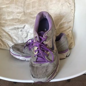 Grey and purple Nike Pegasus 28 running shoes.